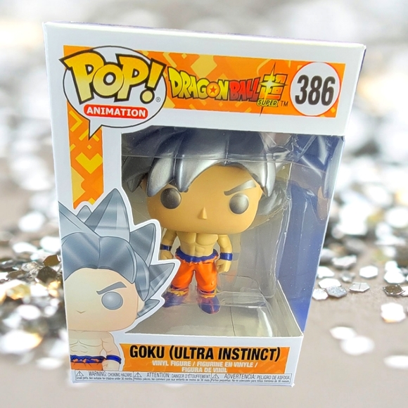 Goku (ultra instinct) funko # 386 (nib) with pop protector - Picture 1 of 7